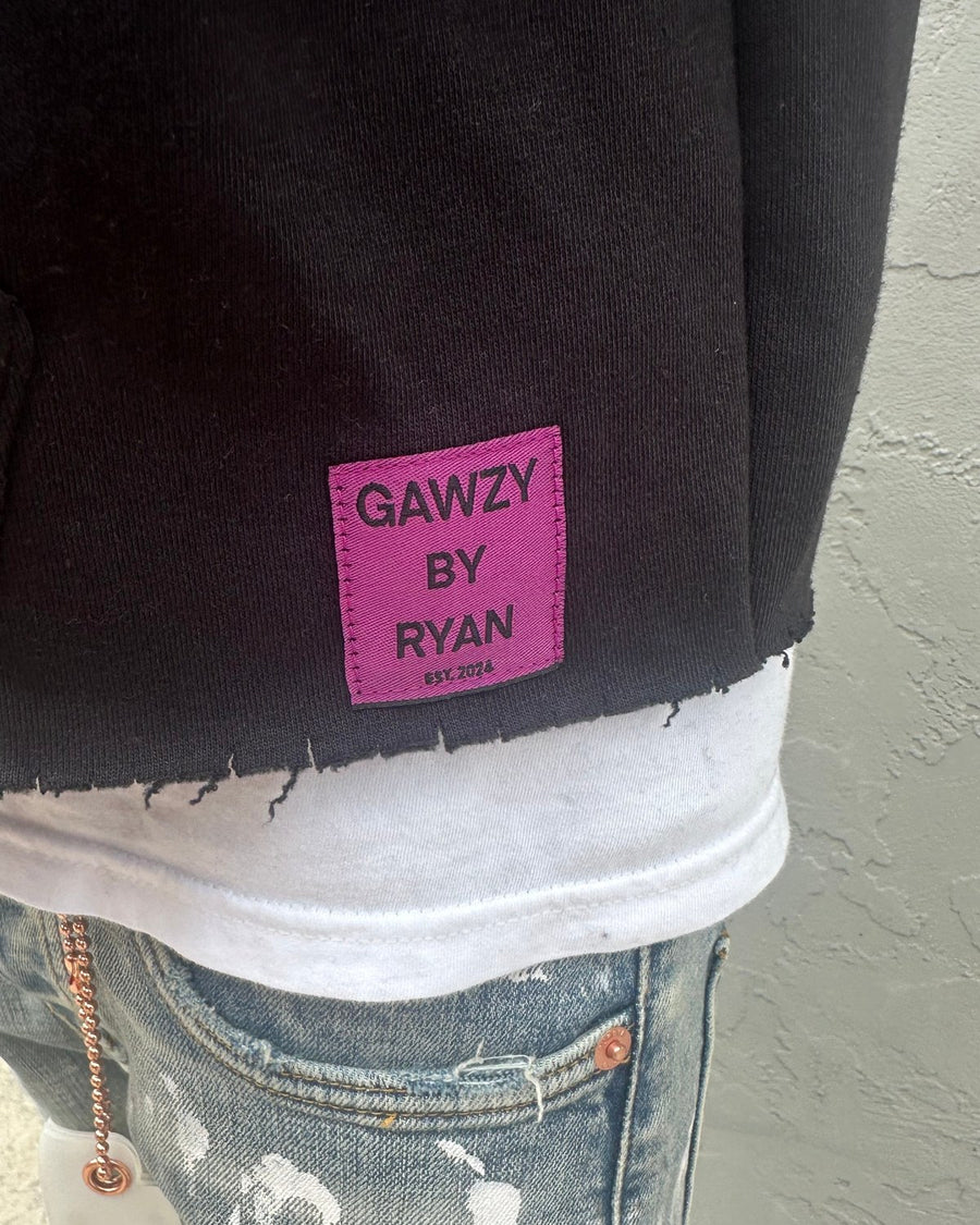 The woven label at the hem.